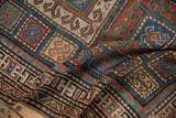 Antique Kurdish runner's intricate rams horn geometric pattern in rust and sky blue.