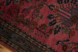 Vintage Lilihan rug detail: raspberry red floral field meets the unusual mir serbend border.