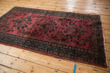 Vintage Lilihan rug's side selvage detail, raspberry floral field, mir serbend border.