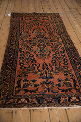 Vintage Lilihan runner with ornate multi-petaled floral designs in dusty raspberry and navy.