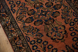 Ornate sapphire blue floral motifs on dusty raspberry field with navy border.