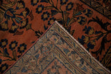 Folded corner of vintage Lilihan rug displays hand-knotted foundation, fringe, and side selvage.