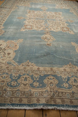 Turkish Sparta rug border detail showing dusty blue and cream motifs, visible knot heads, and intact original selvages.
