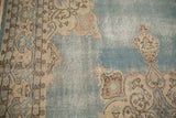 Corner detail of vintage Turkish Sparta carpet: cream spandrel, dusty blue field, exposed knot heads.