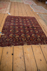 Antique Turkmen rug, geometric guls in burgundy, navy, apricot, with time-worn perimeter.