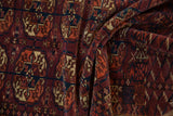 Fine wool pile of the antique Turkmen rug's geometric elephant's footprint guls.