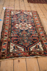 Intricate Herati pattern on a vintage Persian Borchalou rug with navy, ivory, and blush tones.