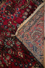 Vintage Lilihan rug showing cherry red floral pile and detailed hand-knotted foundation.