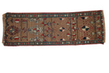 Antique Northwest Persian rug runner with camel field, allover geometric pinwheel motifs in madder red, navy.
