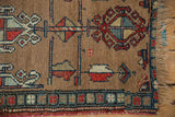 Antique Northwest Persian runner's intricate geometric border, camel field motifs, and hand-knotted fringe.