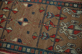 Detail of the antique Northwest Persian runner's camel field, showing pinwheel motifs and dark navy vinery.
