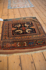 Antique Afshar rug detail showing rich terracotta border and navy field with serrated dragon motifs.