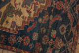Detail of a stepped medallion and stylized Herati animal motifs on a vintage Borchalou rug.