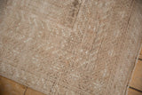 Close view of the distressed texture and even, short pile on a vintage Turkmen rug.