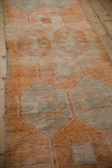 Distressed Kurd runner, geometric starburst guls and hook motif in pale tangerine and ivory.