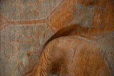 Vintage distressed Kurd runner pile, highlighting pale tangerine geometric pattern and texture.