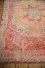 Intact fuchsia side cord and short, abrashed pile on a distressed vintage Kurd rug runner.