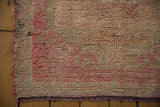 Short, even pile and hand-knotted texture with the fuchsia side cord of a vintage Kurd rug.
