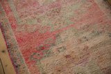 Textured short pile of a vintage Kurd rug in abrashed fuchsia and silver tones.