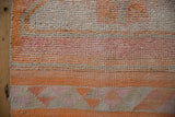 Kurd runner's geometric flatweave border and distressed short pile, in tangerine, fuchsia, ivory.