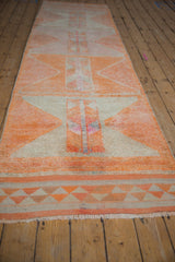 Vintage distressed Kurd runner, with tangerine orange and ivory geometric diamond patterns and abrashes.