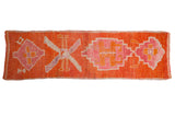 Vintage distressed Kurd rug runner with primitive medallions in bright tangerine orange and fuchsia.