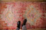 Soft, even pile of a distressed Kurd runner with abrashed raspberry red and silver tones.