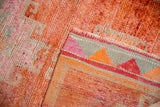 The back of a hand-knotted Kurd rug shows a colorful plain weave and intact side cord.