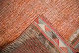 Distressed tangerine pile texture and reverse showing geometric diamond border of Kurd runner.