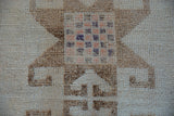 Close-up of a starburst medallion showing its interior checkered pinwheel and low pile.