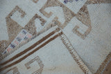 Intact side cord selvage and handwoven foundation of a vintage Kurd runner rug.