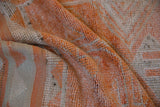 Vintage distressed Kurd runner pile texture, with tangerine orange and soft beige hues.