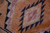 Hand-knotted pile of a vintage Kurd rug showing even wear across the knot heads.