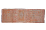 Distressed vintage Kurd runner with tone-on-tone triple medallions in pink, orange, and ivory, 3'4