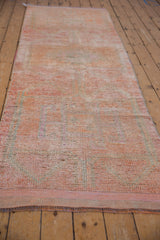 Distressed vintage Kurd runner, showing short pile and muted pink tone-on-tone pattern.