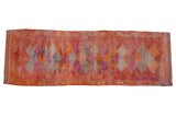Vintage distressed Kurd runner rug with repeating diamonds in tangerine orange, raspberry red, and silver.