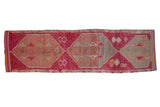Distressed Kurd rug runner, geometric medallions in fuchsia, raspberry, tangerine, and ivory tones.
