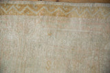Even wear to knot heads and dusty gold chevron border on a vintage Oushak runner.