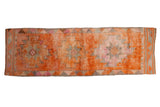 Vintage distressed Kurd runner rug, geometric diamond medallions in tangerine and fuchsia, 3'2