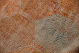 Distressed Kurd runner pile showing knot heads, dusty tangerine, and slate blue tones.