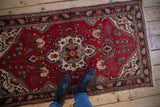 Cherry red Persian Dargezine runner with central floral medallion and blossoming finials.