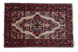Vintage Dargezine rug, ivory field, central floral spray medallion, red, navy, blush spandrels.