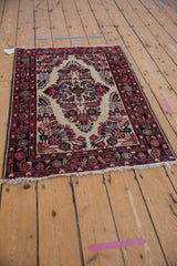 Hand-knotted vintage Dargezine rug, ivory floral medallion detail, blush and black cherry red.