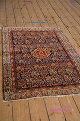 Vintage Serbend rug detail: navy Herati field with vivid blossoms and intricate Zili Sultan boteh border.