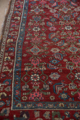 Playful nuanced blossom and floral border and geometric Herati field on vintage Kurdish Hamadan rug.