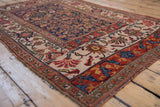 Rich red turtle Samovar main border with ivory arabesque pattern on antique Bijar rug.