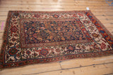 Antique Bijar rug corner with ivory turtle Samovar border and colorful arabesque details.