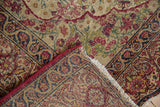 Hand-knotted foundation, red selvage, and fringed edge of the antique Kerman rug.