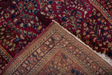 Hand-knotted foundation and even cherry red pile of a vintage American Sarouk rug.
