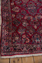 Intricate floral border and intact side selvage of a fine vintage Persian German Sarouk rug.